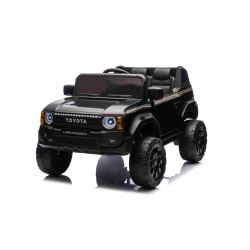 Mașinuță electrică Toyota Landcruiser 12V, negru, scaun lat, telecomandă 2.4 GHz, intrare USB / AUX, Bluetooth, suspensie, baterie litiu, lumini LED, motor 2 x 25W, licență ORIGINALĂ